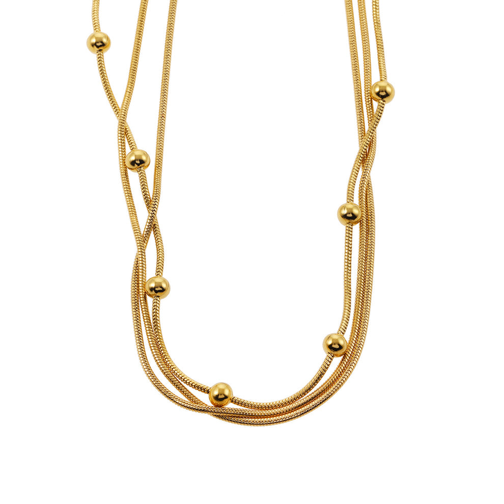 Collier à trois rangs de chaînes effet peau de serpent avec accents de perles rondes